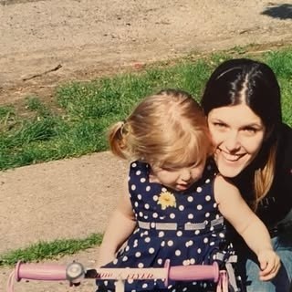 My mom holding me close when I was little